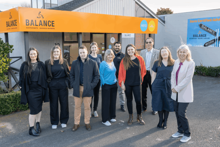 Balance Accountants staff outside their office under orange Balance and Xero Gold Partner signage